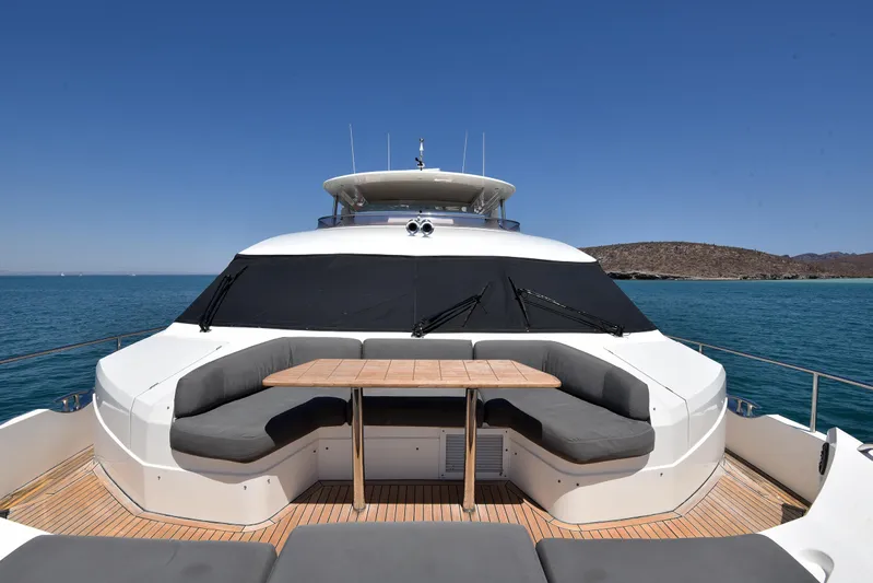 Princess One Yacht Photos Pics 2014 Princess Flybridge 98Y Motor Yacht with outdoor seating, ocean view, and clear blue sky.