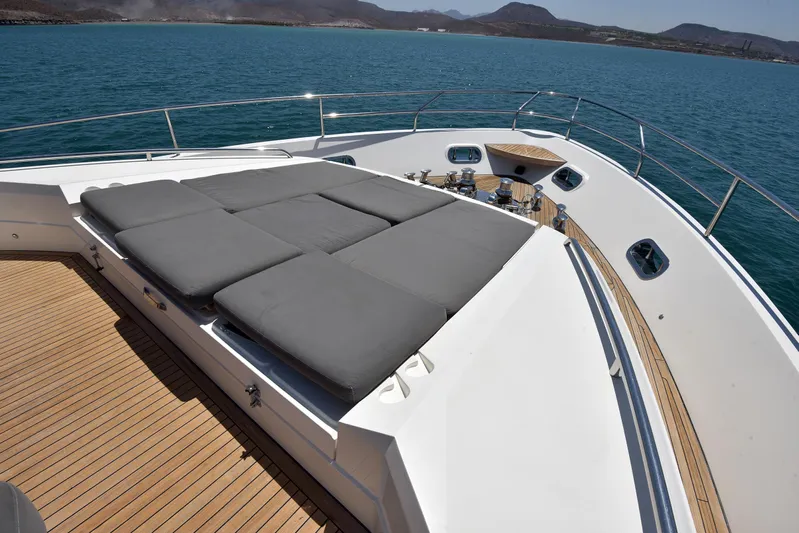 Princess One Yacht Photos Pics Luxurious 2014 Princess Flybridge 98Y Motor Yacht with sunbathing deck on serene water.