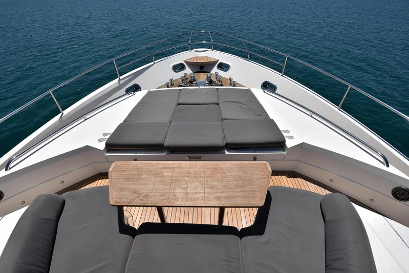 Princess One Yacht Photos Pics Luxurious 2014 Princess Flybridge 98Y Motor Yacht deck with sun loungers and ocean view.