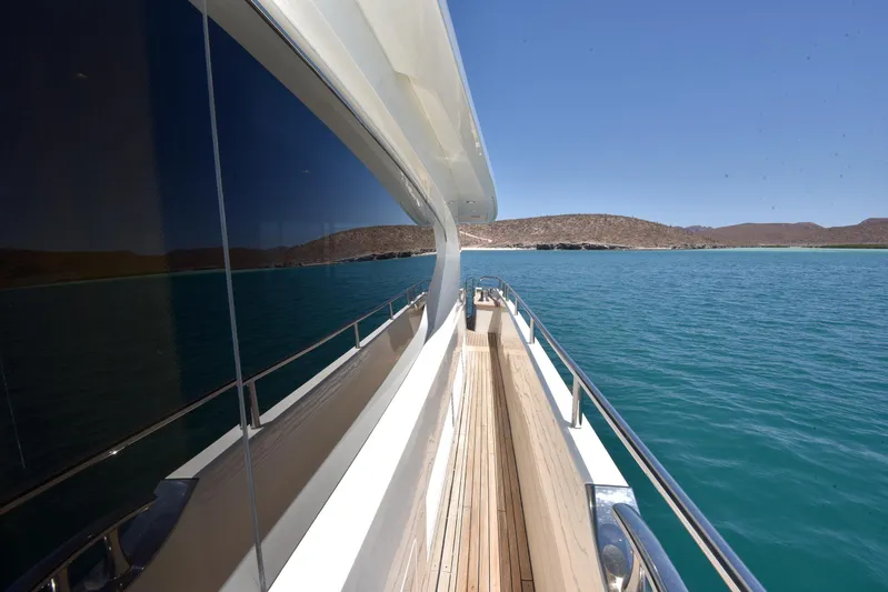 Princess One Yacht Photos Pics 2014 Princess Flybridge 98Y Motor Yacht on serene blue waters, side deck view.