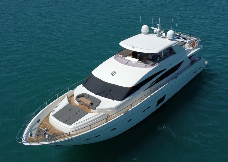 Princess One Yacht Photos Pics Luxurious 2014 Princess Flybridge 98Y Motor Yacht cruising on clear blue waters.