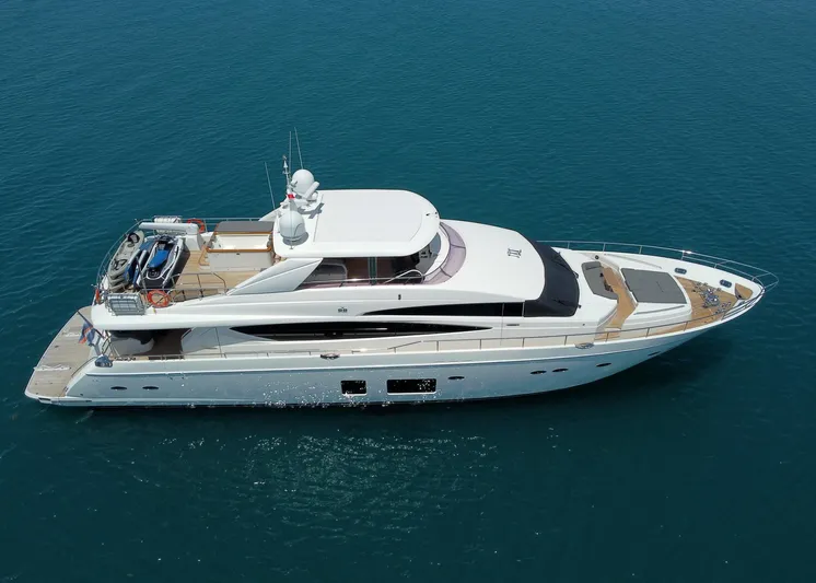 Princess One Yacht Photos Pics Luxurious 2014 Princess Flybridge 98Y Motor Yacht cruising on calm blue waters.