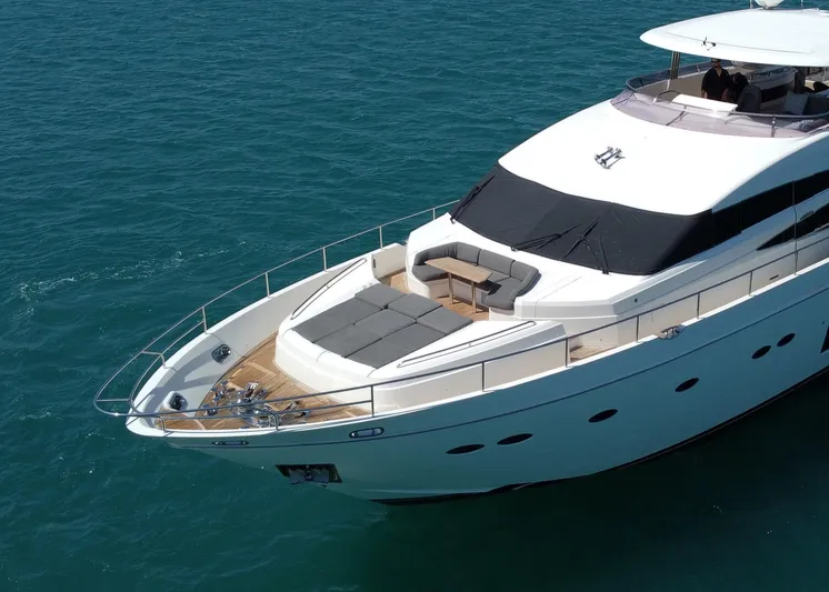 Princess One Yacht Photos Pics Luxurious 2014 Princess Flybridge 98Y Motor Yacht cruising on clear blue waters.