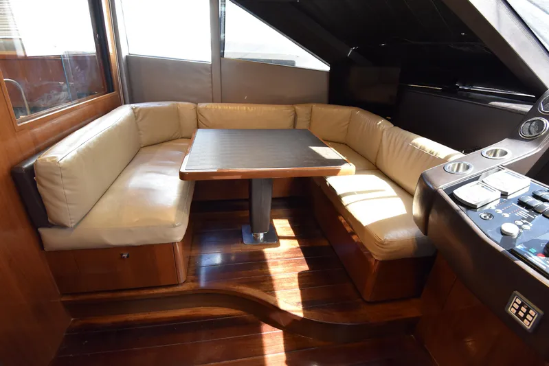 Princess One Yacht Photos Pics Luxurious seating area on 2014 Princess Flybridge 98Y Motor Yacht with wooden flooring.