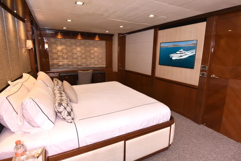 Princess One Yacht Photos Pics Luxurious bedroom interior of 2014 Princess Flybridge 98Y Motor Yacht with elegant decor.