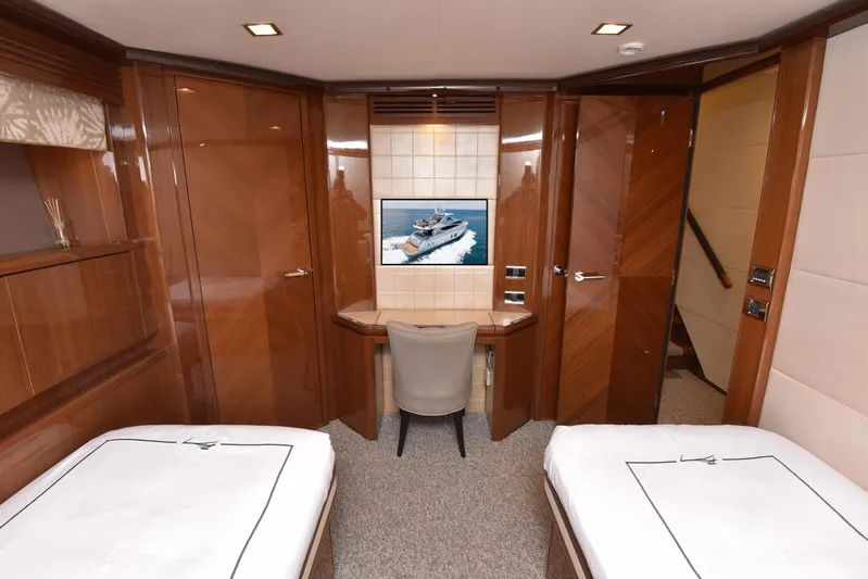 Princess One Yacht Photos Pics Luxurious cabin interior of 2014 Princess Flybridge 98Y Motor Yacht with twin beds and TV.