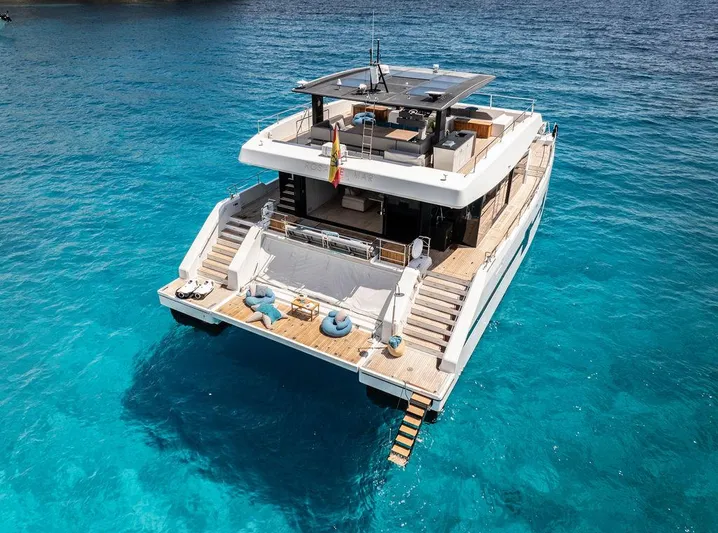 Rosa Del Mar Yacht Photos Pics Luxurious 2017 Sunreef Supreme 68 yacht on clear blue water, showcasing elegant design.