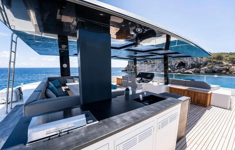 Rosa Del Mar Yacht Photos Pics Luxurious Sunreef Supreme 68 yacht deck with modern amenities, ocean view, and sleek design, 2017 model.