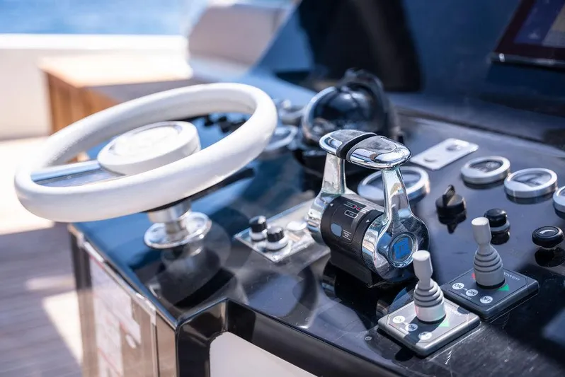 Rosa Del Mar Yacht Photos Pics Helm of 2017 Sunreef Supreme 68 yacht with modern controls and steering wheel.