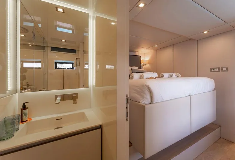 Rosa Del Mar Yacht Photos Pics Luxurious interior of 2017 Sunreef Supreme 68 yacht, featuring a modern bedroom and bathroom.