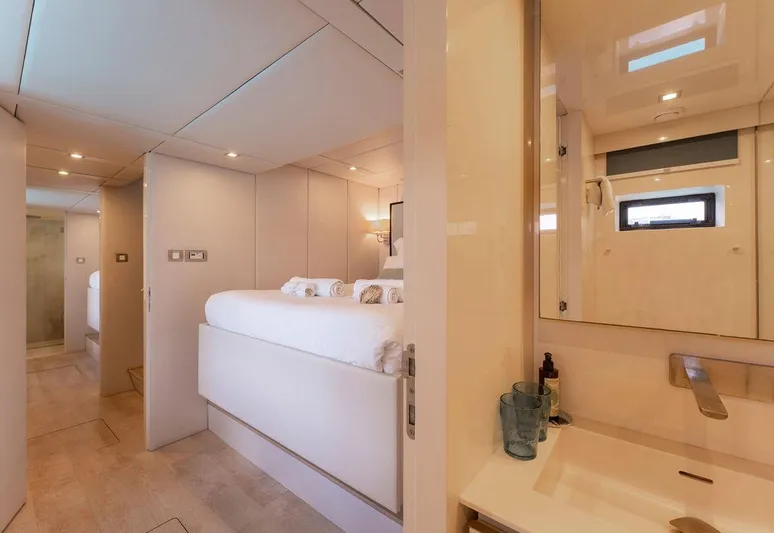 Rosa Del Mar Yacht Photos Pics Luxurious interior of 2017 Sunreef Supreme 68 yacht with modern bedroom and bathroom.