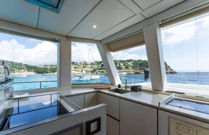 Rosa Del Mar Yacht Photos Pics Modern kitchen interior on 2017 Sunreef Supreme 68 yacht with ocean view.