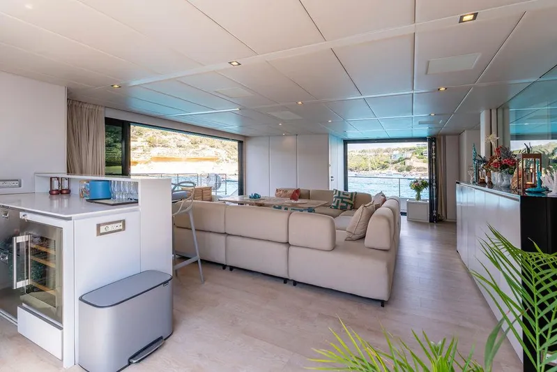 Rosa Del Mar Yacht Photos Pics Luxurious interior of 2017 Sunreef Supreme 68 yacht with modern furnishings and scenic views.