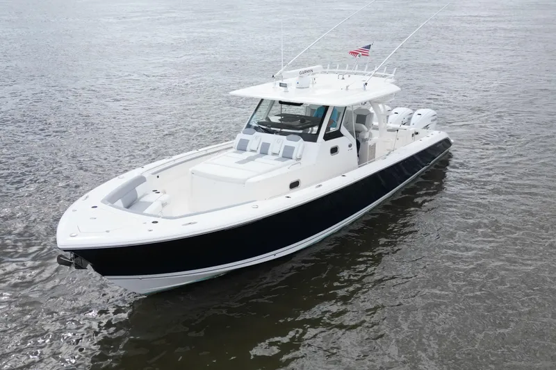  Yacht Photos Pics 2020 Pursuit S 408 Sport boat on water, featuring sleek design and powerful engines.