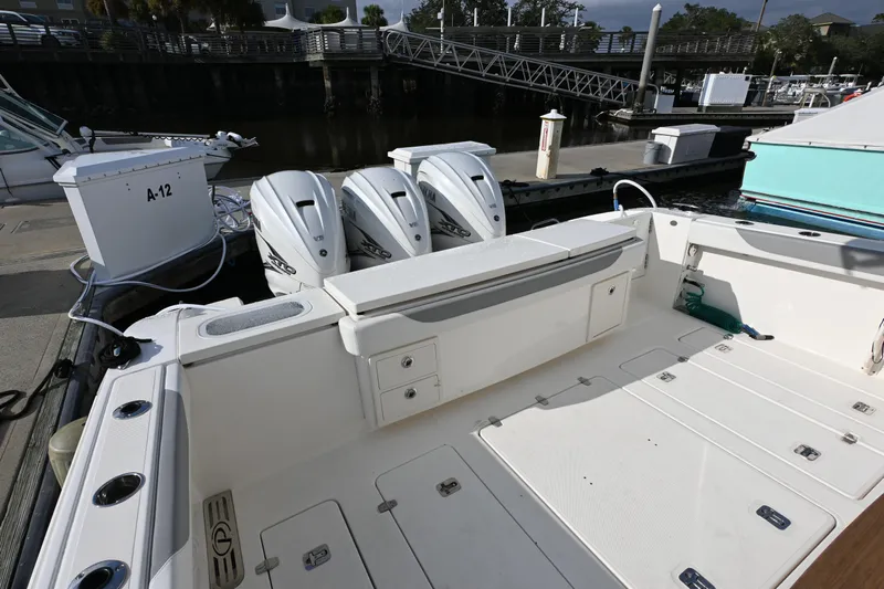  Yacht Photos Pics 2020 Pursuit S 408 Sport boat with triple engines docked at marina.