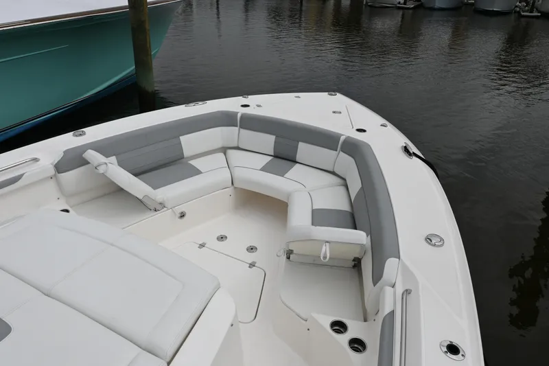  Yacht Photos Pics 2020 Pursuit S 408 Sport boat with spacious seating area in marina.