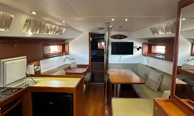 Lele Kalua Yacht Photos Pics Interior of 2014 Beneteau Oceanis 41 yacht with modern kitchen and cozy seating area.
