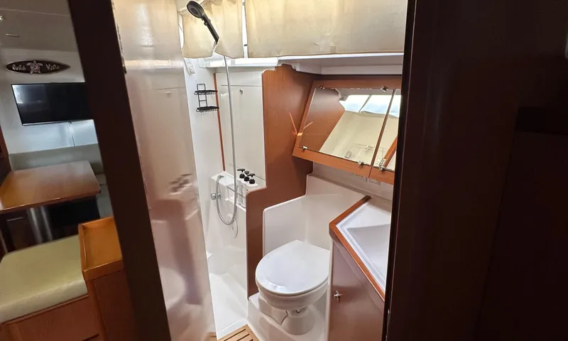 Lele Kalua Yacht Photos Pics Interior of 2014 Beneteau Oceanis 41 yacht bathroom with shower and toilet.