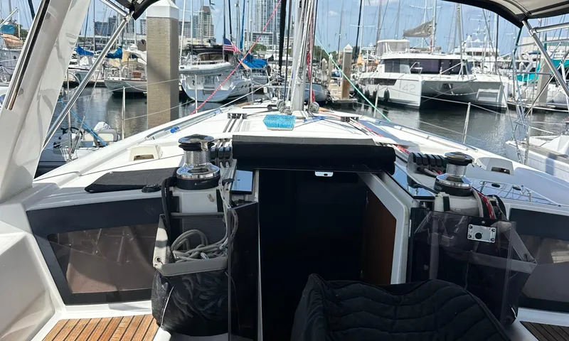 Lele Kalua Yacht Photos Pics 2014 Beneteau Oceanis 41 sailboat cockpit with marina view, featuring winches and seating.