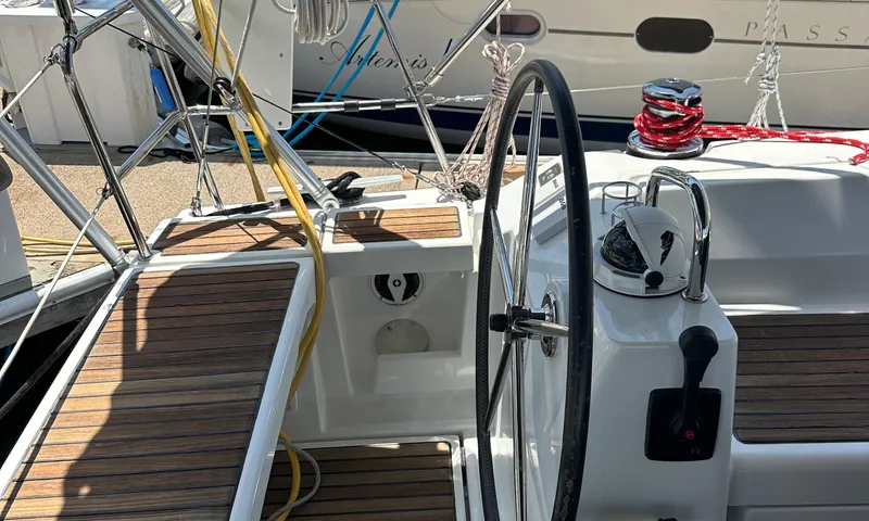 Lele Kalua Yacht Photos Pics Cockpit of 2014 Beneteau Oceanis 41 sailboat with steering wheel and winch.