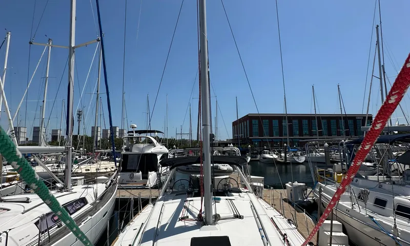 Lele Kalua Yacht Photos Pics 2014 Beneteau Oceanis 41 sailboat docked in a marina under clear blue skies.