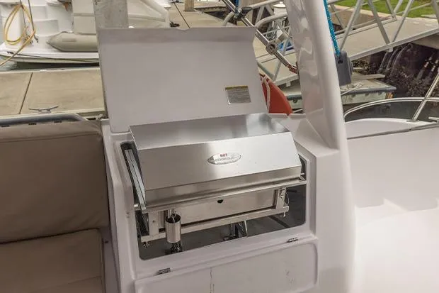 Honu Kai Yacht Photos Pics Outdoor grill on 2019 Seawind 1260 catamaran deck, docked at marina.