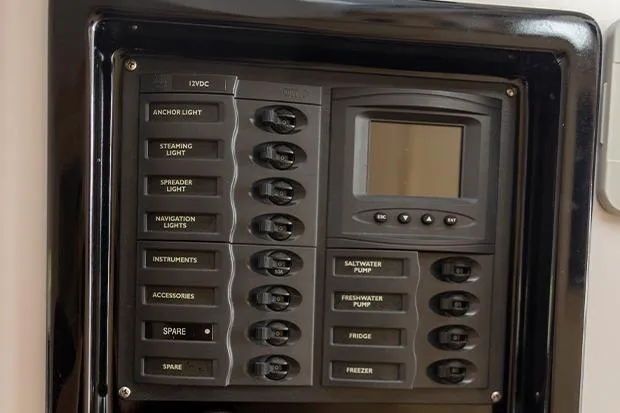 Honu Kai Yacht Photos Pics Control panel of a 2019 Seawind 1260 catamaran with labeled switches and display.