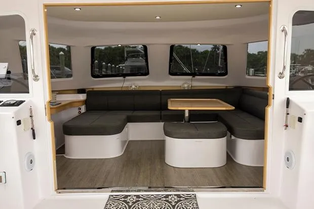 Honu Kai Yacht Photos Pics Interior of 2019 Seawind 1260 catamaran with modern seating and dining area.