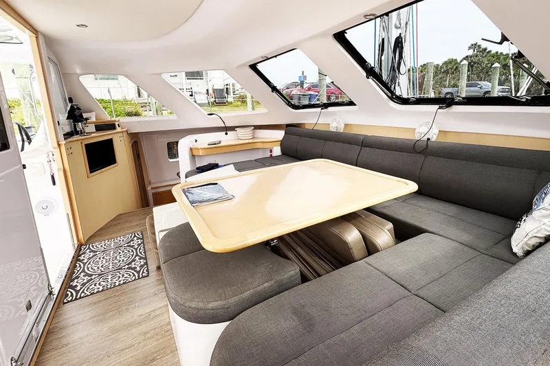 Honu Kai Yacht Photos Pics Interior of 2019 Seawind 1260 catamaran with modern seating and dining area.