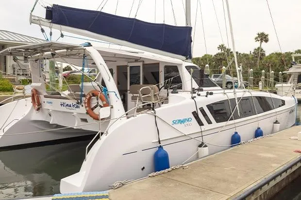 Honu Kai Yacht Photos Pics 2019 Seawind 1260 catamaran docked, featuring sleek design and spacious deck.