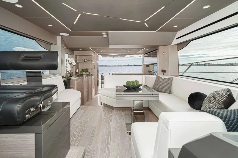  Yacht Photos Pics Luxurious interior of 2021 Sunseeker Manhattan 55 yacht with modern furnishings and scenic ocean view.