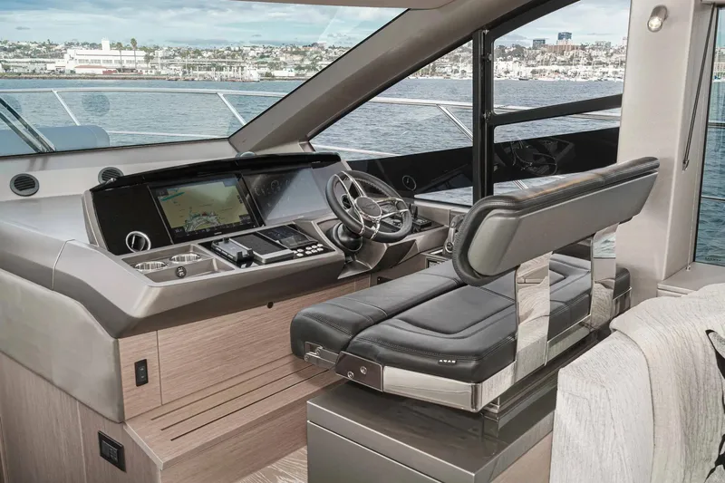  Yacht Photos Pics Luxurious helm of 2021 Sunseeker Manhattan 55 yacht with modern navigation system.