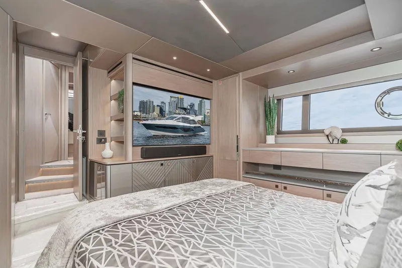  Yacht Photos Pics Luxurious interior of 2021 Sunseeker Manhattan 55 yacht bedroom with modern decor.