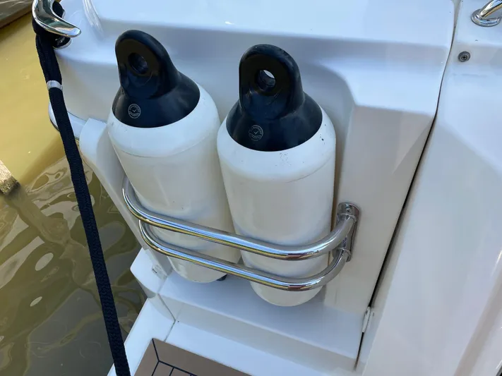 Esquire Yacht Photos Pics Fenders on a 2017 Riviera 3600 Sport Yacht, secured with stainless steel holders.
