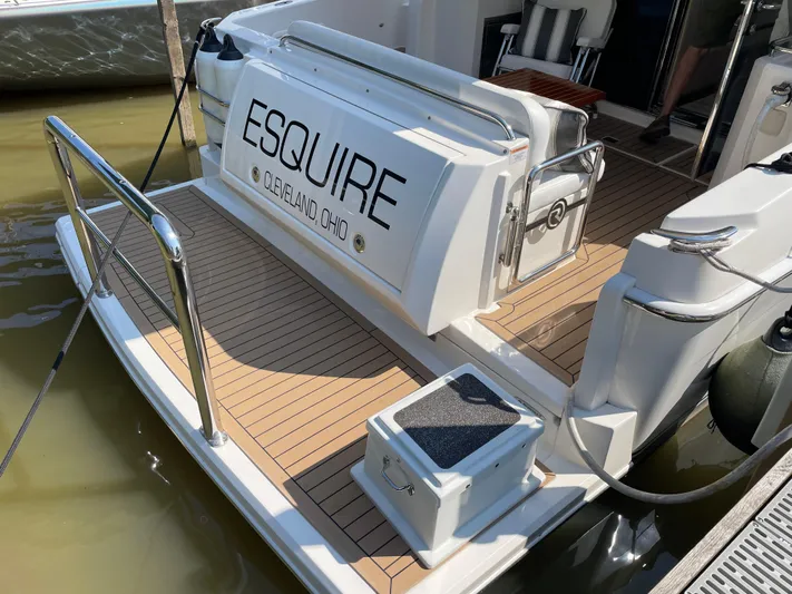 Esquire Yacht Photos Pics 2017 Riviera 3600 Sport Yacht docked, featuring teak deck and "Esquire" nameplate.