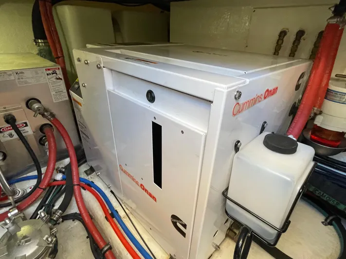 Esquire Yacht Photos Pics Engine room of 2017 Riviera 3600 Sport Yacht with Cummins Onan generator.