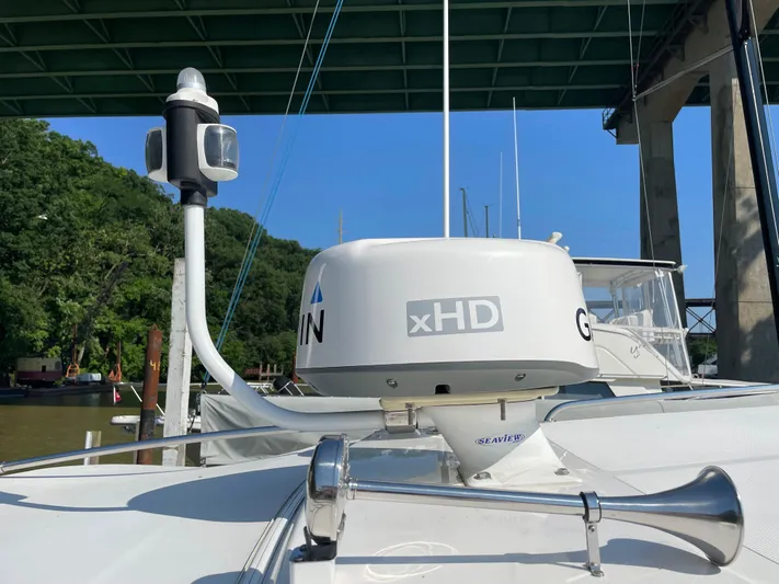 Esquire Yacht Photos Pics 2017 Riviera 3600 Sport Yacht with radar and horn under a bridge.