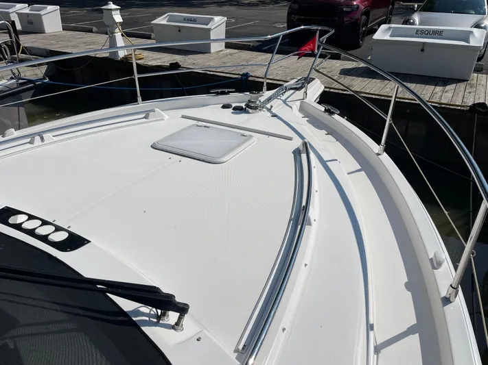 Esquire Yacht Photos Pics 2017 Riviera 3600 Sport Yacht docked, showcasing sleek deck design and modern features.