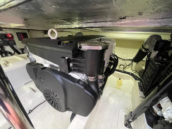 Esquire Yacht Photos Pics Engine room of a 2017 Riviera 3600 Sport Yacht, showcasing mechanical components.