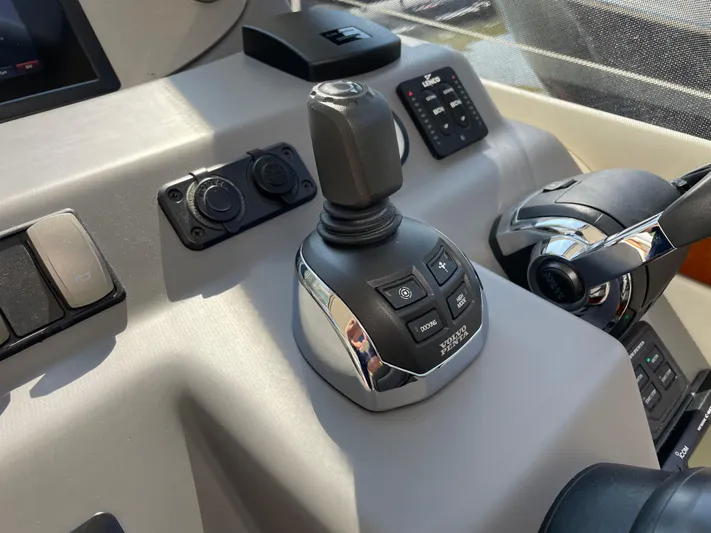 Esquire Yacht Photos Pics Control panel of a 2017 Riviera 3600 Sport Yacht with joystick and throttle.