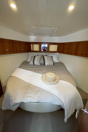 Esquire Yacht Photos Pics Cozy bedroom in 2017 Riviera 3600 Sport Yacht with elegant bedding and decor.