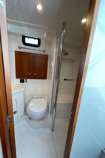 Esquire Yacht Photos Pics Bathroom interior of 2017 Riviera 3600 Sport Yacht with shower and wooden cabinet.
