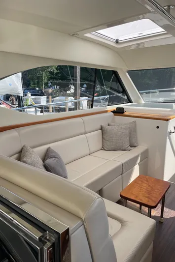 Esquire Yacht Photos Pics Luxurious interior of 2017 Riviera 3600 Sport Yacht with plush seating and elegant design.