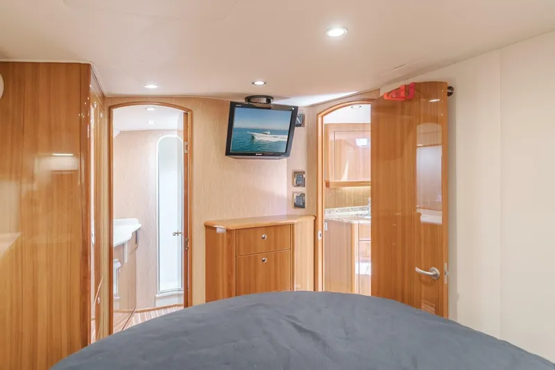 Endurance Yacht Photos Pics Interior of 2008 Viking 52 Sport Coupe yacht with wood finish and mounted TV.