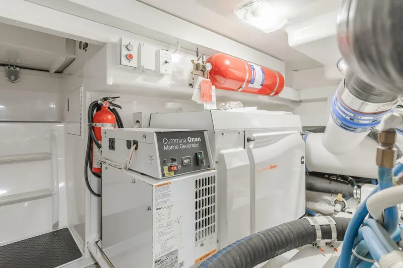 Endurance Yacht Photos Pics Engine room of 2008 Viking 52 Sport Coupe with Cummins Onan marine generator.