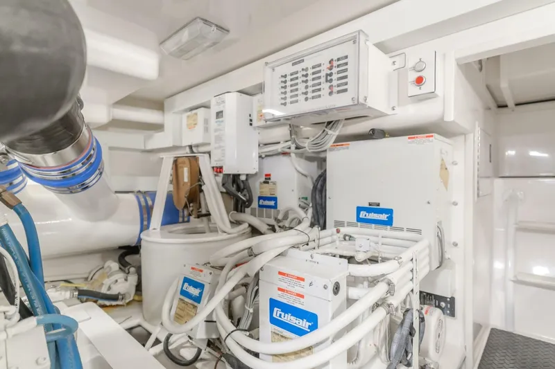 Endurance Yacht Photos Pics Engine room of 2008 Viking 52 Sport Coupe with mechanical equipment and control panels.