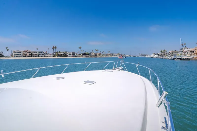 Endurance Yacht Photos Pics Bow view of 2008 Viking 52 Sport Coupe cruising in a scenic coastal area.