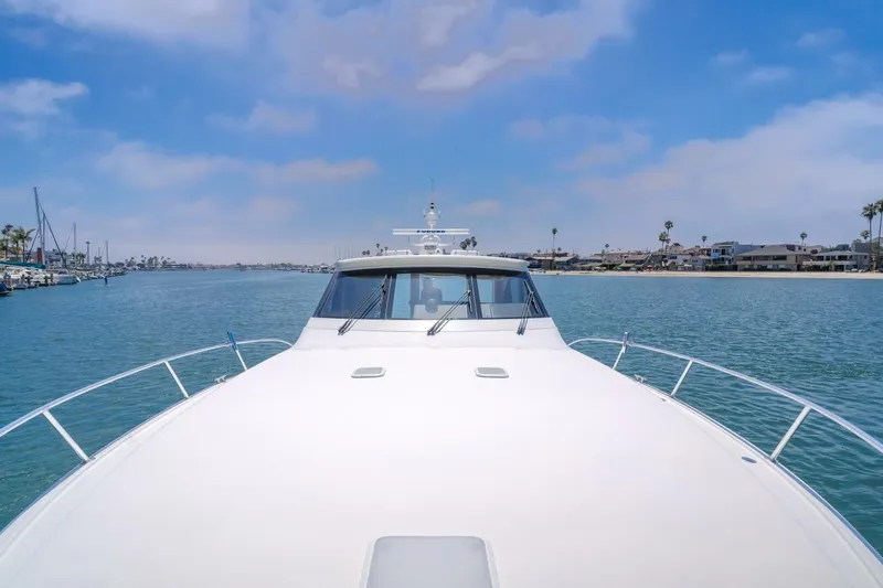 Endurance Yacht Photos Pics 2008 Viking 52 Sport Coupe yacht cruising in a scenic coastal area.