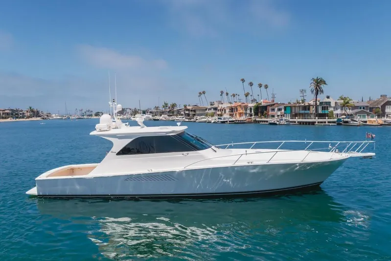 Endurance Yacht Photos Pics 2008 Viking 52 Sport Coupe yacht cruising in a scenic coastal area.