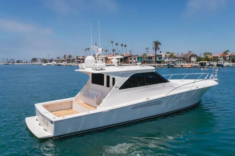 Endurance Yacht Photos Pics 2008 Viking 52 Sport Coupe yacht cruising in a scenic harbor setting.